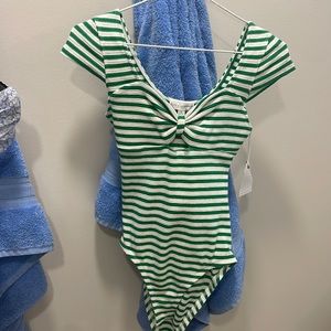 Green and white bodysuit